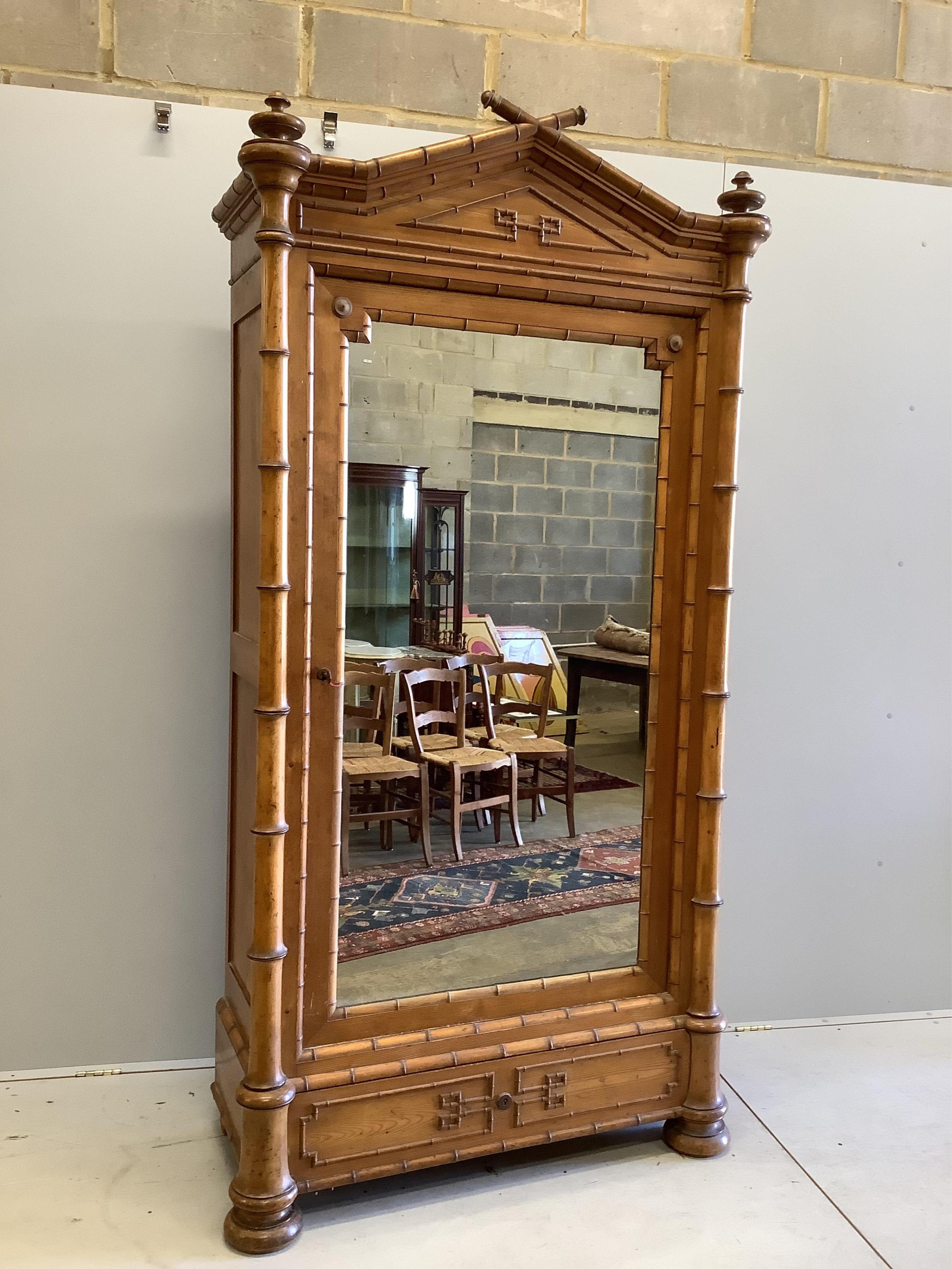 A late 19th century French bamboo and pine armoire, width 122cm, height 224cm. Condition - good condition, mirror looks later